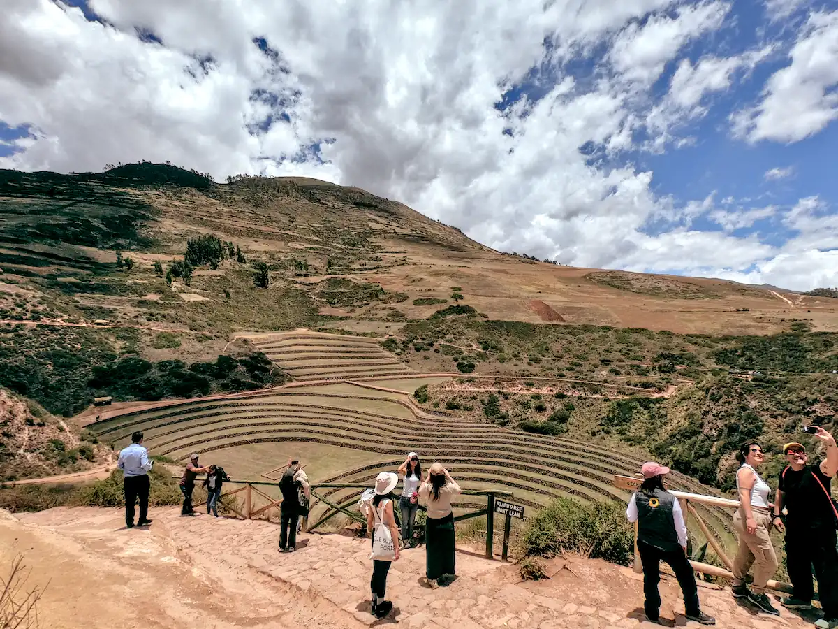 Group Of Tourists Taking Photos Of The Moray Concentric Terraces