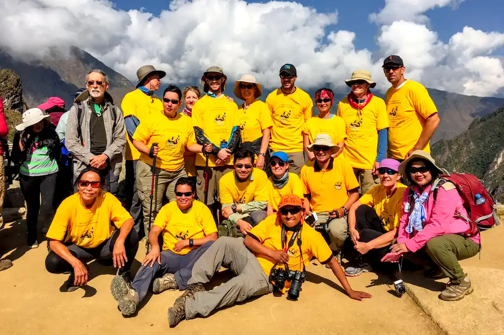 Group Tourists Celebrating Finish Inca Trail To Machu Picchu